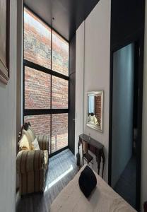 Ένα ή περισσότερα κρεβάτια σε δωμάτιο στο Apartamento Uruguay Centro Histórico +9 φωτογραφίες