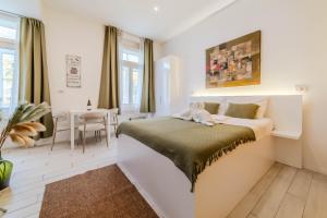 Voodi või voodid majutusasutuse Central Boutique Apartments LuAn toas