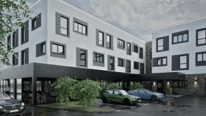a rendering of a building with cars parked in a parking lot at Hotel Siscia in Sisak