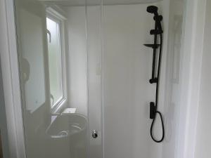 a bathroom with a sink and a window at Lakeland Leisure Park - Holiday Accommodation 20349 in Flookburgh +5 photos