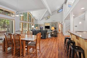 a dining room and living room with a table and chairs at 1 Colonial in Sunriver