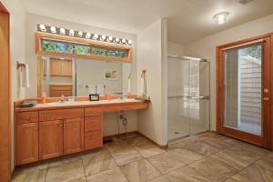 a bathroom with a sink and a shower at 1 Colonial in Sunriver +42 photos