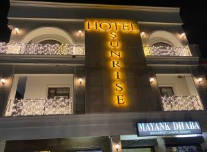 a hotel sign on the side of a building at Hotel Sunrise in Chandīgarh