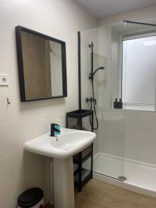 a white bathroom with a sink and a shower at Casa ARANAL in Málaga +15 photos