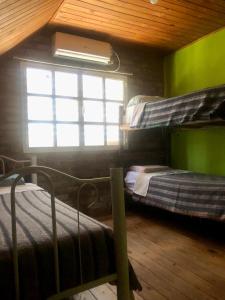 a room with two bunk beds and a window at Complejo Turístico Hugo Ávila in La Rioja +35 photos