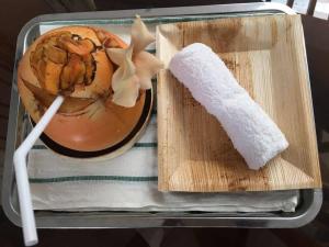 a lunch box with a bowl of food and a burrito at Seasons Villa Sigiriya, Sri Lanka in Dambulla +32 photos