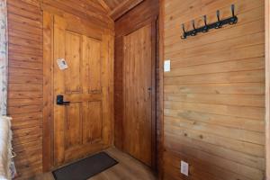 a wooden hallway with a door in a room at Domaine de l Archipel in Sorel
