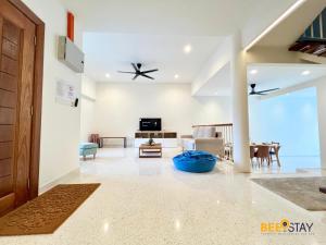 a living room with a ceiling fan and a couch at SS2 Landed in Petaling Jaya for 8 Pax in Gua Sai
