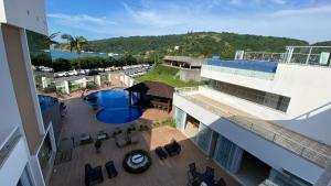 an overhead view of a building with a pool at Reserva Praia Hotel in Balneário Camboriú