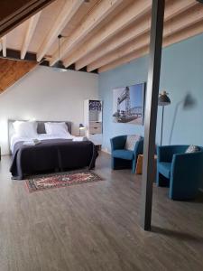 Ένα ή περισσότερα κρεβάτια σε δωμάτιο στο De Gaanderij bed and Breakfast