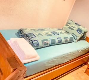 A bed or beds in a room at window on the green