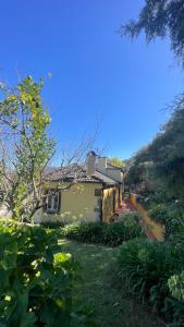 a house sitting on top of a lush green field at CASA da LINHA in Caminha