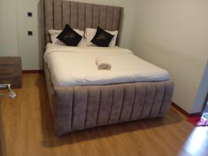 Ένα ή περισσότερα κρεβάτια σε δωμάτιο στο Blonch's Airbnbs