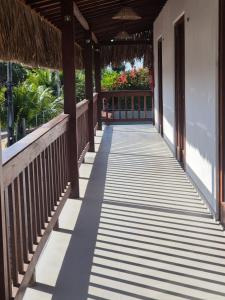 a walkway leading to the front porch of a house at Pousada Janela dos Ventos in Caucaia +6 photos