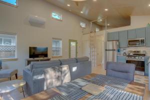 a living room with a couch and a table at Mod Pod in Bend