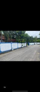 an empty street with blue barriers on the side of a road at accomodation katunayaka in Negombo