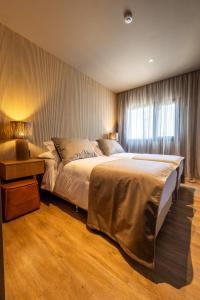 Postel nebo postele na pokoji v ubytování Bravo Hotel