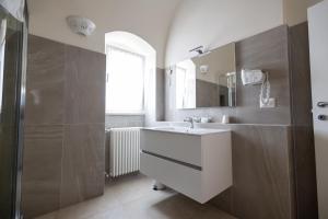 a bathroom with a sink and a shower at Antica Dimora storica La finestra sul campanile in Matera +41 photos