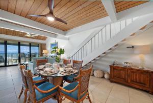 a dining room with a table and chairs at Kahana Village 34 · KHV 34 Direct Ocean Front Views 2BD Kahana C in Kahana