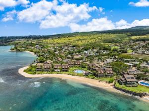 an aerial view of a resort on a beach at Kahana Village 34 · KHV 34 Direct Ocean Front Views 2BD Kahana C in Kahana