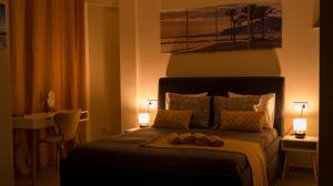 a bedroom with a bed with two towels on it at Zapillo beach in Almería