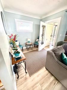 a living room with a couch and a table at Cozy Home By University Circle VA,CC & Museum in Cleveland
