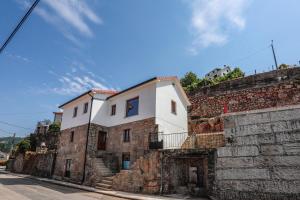 a building on top of a stone wall at Mirando Espanha in Melgaço