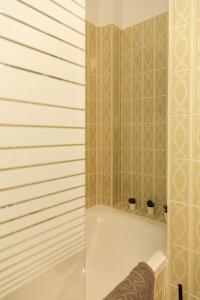 a bathroom with a shower with a bath tub at HeideHygge 2 in Schneverdingen +26 photos