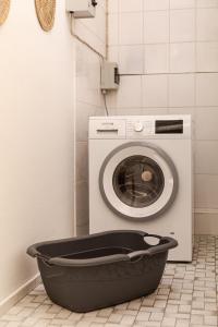 a washer and dryer sitting in a bathroom with at HeideHygge 2 in Schneverdingen