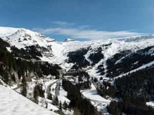 a snow covered mountain with trees and a ski slope at Studio rénové à Flaine Forêt, résidence Sirius, à 500m des pistes – 5 couchages - FR-1-687-17 in Arâches-la-Frasse +2 photos