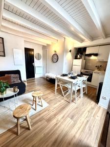 a living room with a couch and a table at Le 41 - Cosy et Confort in Barèges +29 photos