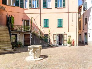 a building with a bucket in the middle of a street at Center House Via Anghileri in Lecco