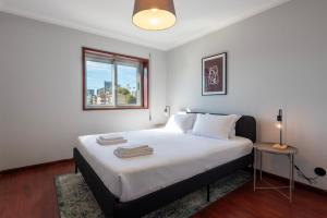 Postel nebo postele na pokoji v ubytování NEW! The Porto Wine Cellars Penthouse