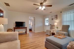 a living room with a couch and a ceiling fan at Wine Country Retreat with Fire Pit and Sunroom! in Dahlonega