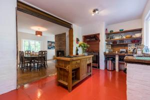 a kitchen and dining room with a table in it at Large family home based at Westerlands Farm in Graffham