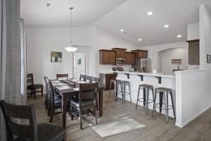 a kitchen and dining room with a table and chairs at Four Seasons Retreat in Sunriver