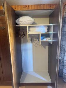 an empty refrigerator with its door open in a room at Apartaments Eischoll in Arni Alp +5 photos