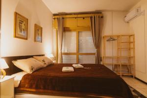 Ένα ή περισσότερα κρεβάτια σε δωμάτιο στο IKE Hospedagem Centro-Unidade2