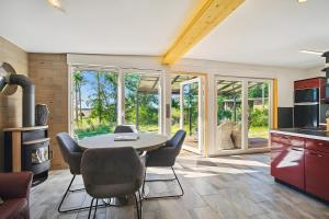 a kitchen with a table and chairs in a room at Ferienhaus 110 in Stelzendorf