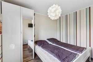 Ένα ή περισσότερα κρεβάτια σε δωμάτιο στο Ferienhaus 257