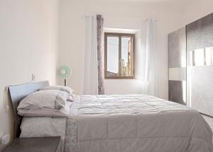 Postel nebo postele na pokoji v ubytování Affittacamere da Lory