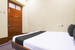 Ένα ή περισσότερα κρεβάτια σε δωμάτιο στο SPOT ON SR CONTINENTAL