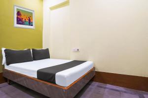 Ένα ή περισσότερα κρεβάτια σε δωμάτιο στο SPOT ON SR CONTINENTAL