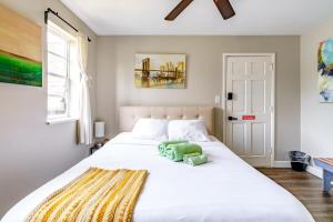 a bedroom with a bed with a teddy bear on it at Jungle House Columbus Downtown Free Parking Sleeps 6 - Steps to Convention Center & Nationwide Arena - 1BR Short North Luxury Home - Over 5,800 Five Star Stays in Columbus