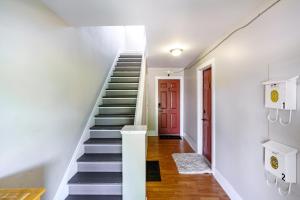 a staircase in a house with a red door at Short North Convention Private Parking Pets! in Columbus +33 photos