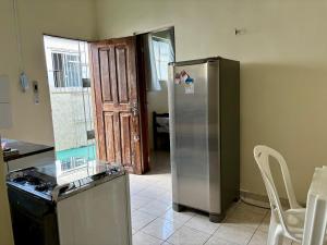 a kitchen with a refrigerator and a table and chairs at Residencial Dom Luiz in Belém +24 photos