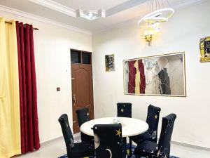 a dining room with a table and chairs at Wan Z Homestay Pasir Mas in Pasir Mas