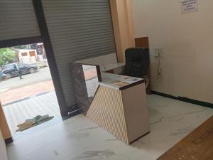 an office with a desk and a chair in a room at Hotel Krishna Raj in Ujjain