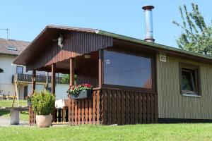 a building with a large window on the side of it at Haus Kathan in Bechtersweiler