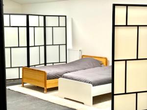 Postel nebo postele na pokoji v ubytování Spacious DownTown BXL Loft with Private Parking